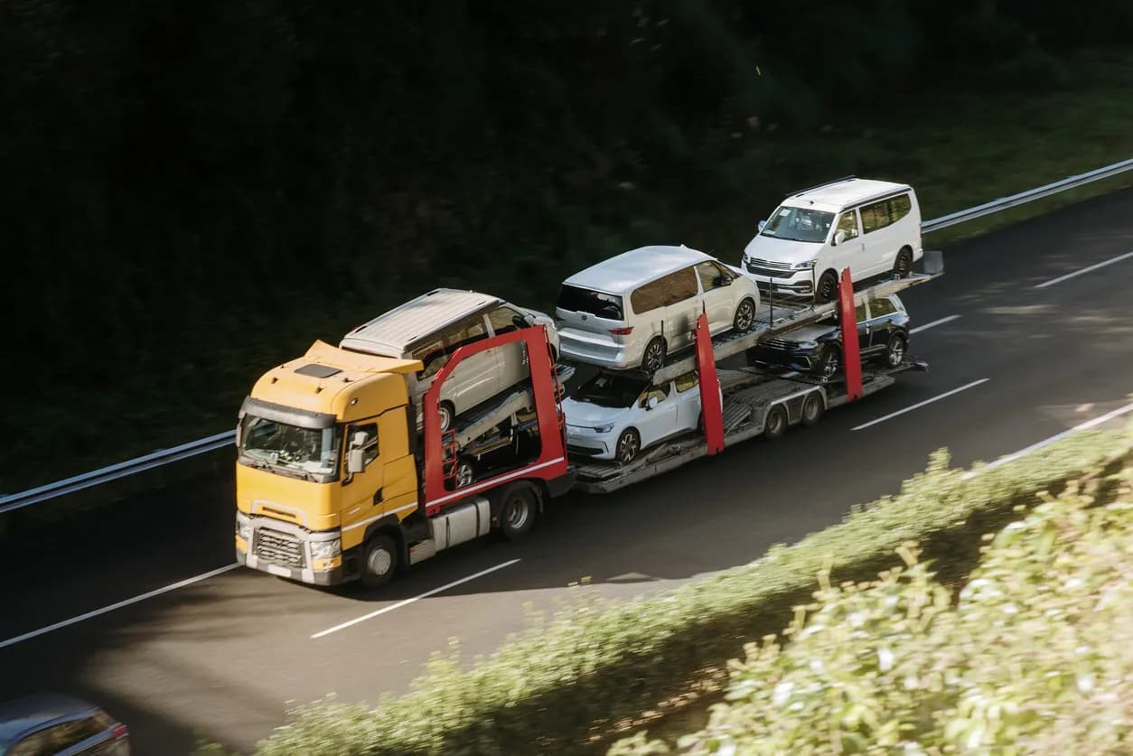 Car transporter truck transporting vehicles on highway - Connecticut auto transport