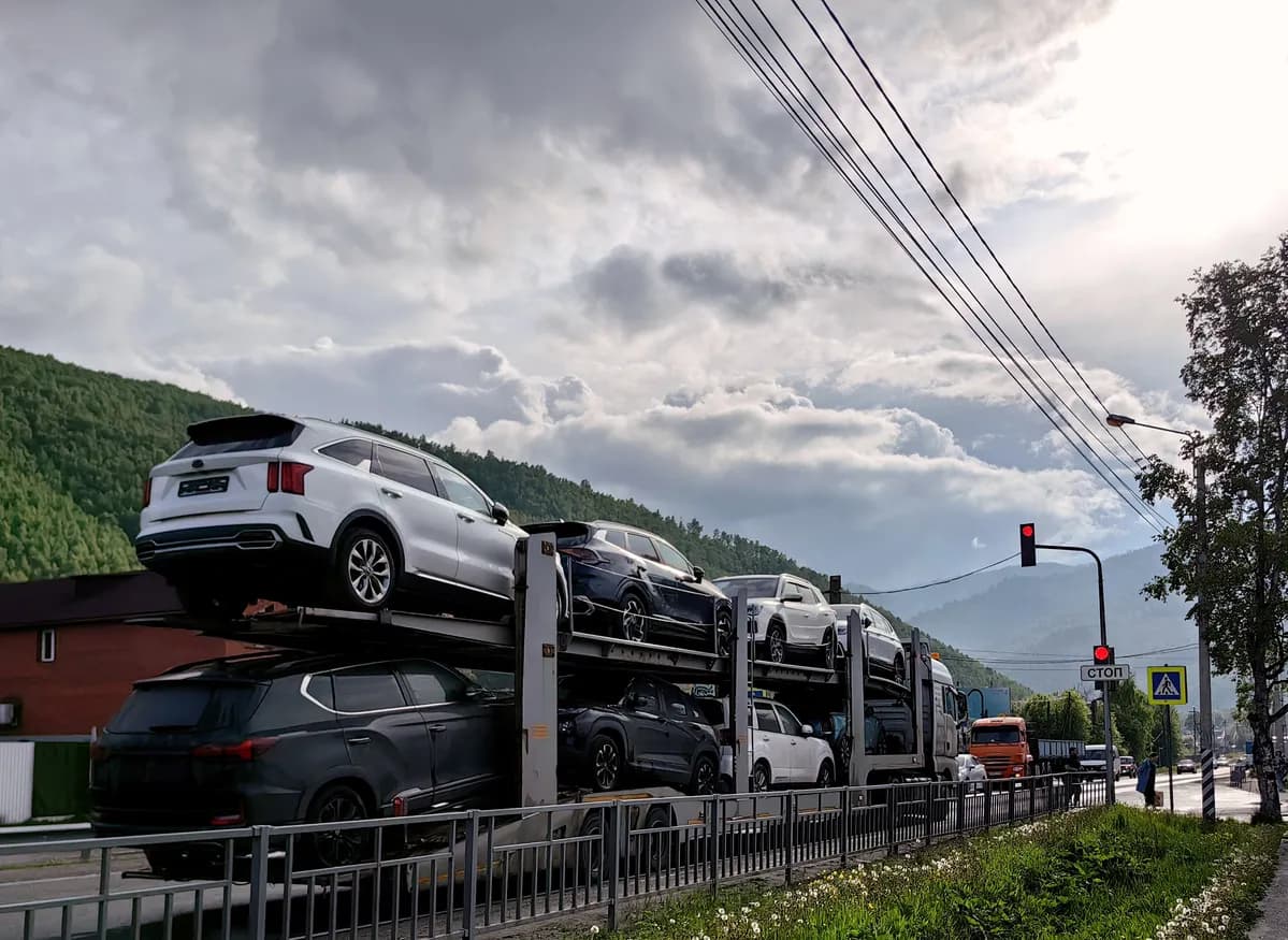 Car transporter truck transporting vehicles on highway - Indiana auto transport