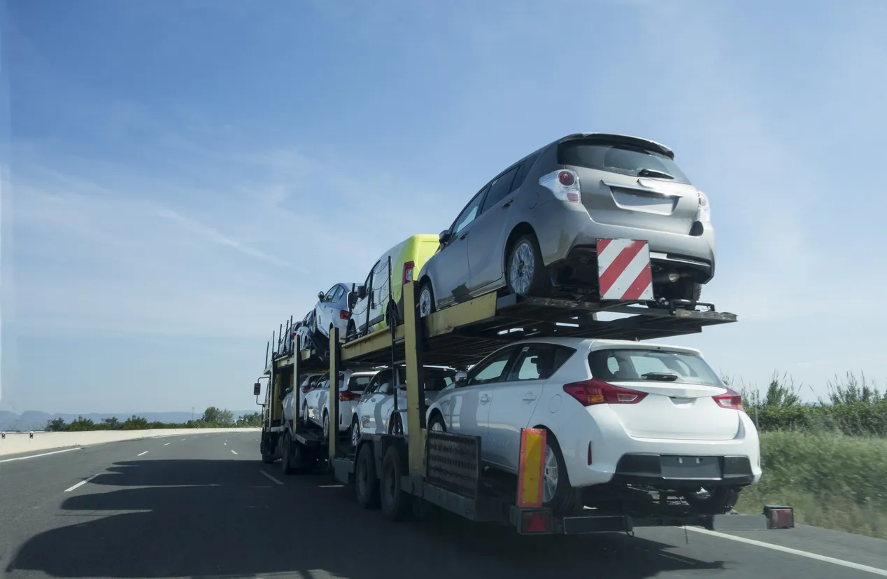 Car transporter truck transporting vehicles in North Dakota