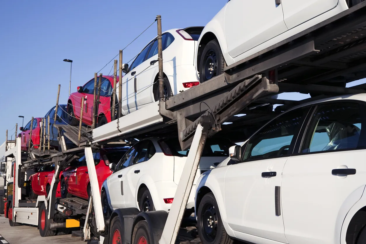 Car transporter truck transporting vehicles in Rhode Island